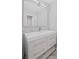 Stylish bathroom vanity with modern faucet, neutral cabinets, and large mirror at 3650 River Rock Rd, Lithonia, GA 30038
