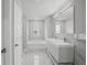Modern bathroom featuring a double sink vanity, a soaking tub and tile flooring at 3650 River Rock Rd, Lithonia, GA 30038