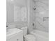 Bathroom features white marble tiling and modern fixtures at 3650 River Rock Rd, Lithonia, GA 30038
