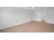 Spacious bedroom with a ceiling fan, hardwood floors, and a large doorway at 3650 River Rock Rd, Lithonia, GA 30038
