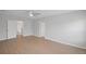 Spacious bedroom with a ceiling fan, hardwood floors, and plenty of natural light at 3650 River Rock Rd, Lithonia, GA 30038