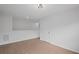 Bright bedroom featuring wood-look floors, light fixtures, and a white paneled door at 3650 River Rock Rd, Lithonia, GA 30038