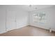 Bright bedroom with a window and hardwood floors at 3650 River Rock Rd, Lithonia, GA 30038