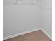 Empty walk-in closet with wire shelving and hardwood floors at 3650 River Rock Rd, Lithonia, GA 30038