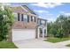 Inviting two-story home with a brick front and siding, showcasing a clean driveway and lush green lawn at 3650 River Rock Rd, Lithonia, GA 30038