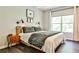 Cozy bedroom with a large window, stylish lighting, and modern decor at 955 Juniper Ne St # 4332, Atlanta, GA 30309