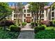 Courtyard garden path through meticulously landscaped green spaces and mature trees near the property at 955 Juniper Ne St # 4332, Atlanta, GA 30309