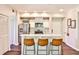 Modern kitchen features stainless steel appliances, white cabinetry, and bar seating at 955 Juniper Ne St # 4332, Atlanta, GA 30309