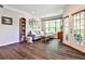 Spacious living room featuring a comfortable sectional, bookcase, and door to the patio at 955 Juniper Ne St # 4332, Atlanta, GA 30309
