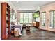 Spacious living room featuring a comfortable sectional, bookcase, and door to the patio at 955 Juniper Ne St # 4332, Atlanta, GA 30309