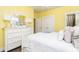 Inviting bedroom featuring a large dresser, mirror, and white accents at 963 South On Main Dr, Woodstock, GA 30188