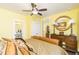 Bright bedroom featuring warm yellow walls, stylish furnishings, and an adjacent bathroom for added convenience at 963 South On Main Dr, Woodstock, GA 30188