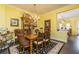 Formal dining room features hardwood floors, decorative chandelier, and elegant furnishings at 963 South On Main Dr, Woodstock, GA 30188
