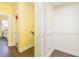 Bright hallway leading to a bedroom and bathroom with an elevator on the side at 963 South On Main Dr, Woodstock, GA 30188
