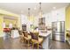 Bright kitchen with white cabinets, gray island, stainless steel appliances, and island seating at 963 South On Main Dr, Woodstock, GA 30188