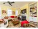 Bright living room with built-in shelving, fireplace, and comfortable seating area at 963 South On Main Dr, Woodstock, GA 30188