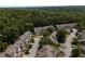 An aerial view of townhomes surrounded by green trees in a residential neighborhood at 1002 Saddle Hl, Marietta, GA 30068