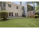A spacious backyard featuring a lush lawn, patio, and partial fence at 1002 Saddle Hl, Marietta, GA 30068