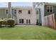 Large, well-maintained backyard with lawn, privacy fence, and access to the home at 1002 Saddle Hl, Marietta, GA 30068
