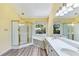 Bathroom featuring a window, garden tub, walk-in shower, and dual sinks at 1002 Saddle Hl, Marietta, GA 30068