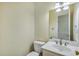 Clean half-bathroom with vanity, sink, and modern fixtures at 1002 Saddle Hl, Marietta, GA 30068
