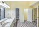 Bathroom featuring a double vanity, pendant lighting, and views to the closet and toilet at 1002 Saddle Hl, Marietta, GA 30068