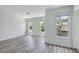 Bright, spacious bedroom featuring three large windows and attractive wood-look flooring at 1002 Saddle Hl, Marietta, GA 30068