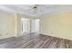 Bedroom featuring wood-look floors and views to an ensuite bathroom, closet, and hallway at 1002 Saddle Hl, Marietta, GA 30068