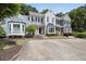 Attractive townhome featuring well-maintained landscaping and a dedicated parking area at 1002 Saddle Hl, Marietta, GA 30068