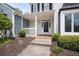Charming covered front porch and well-kept landscaping welcome you home at 1002 Saddle Hl, Marietta, GA 30068