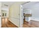 Spacious hallway featuring hardwood floors, adjacent to the kitchen at 1002 Saddle Hl, Marietta, GA 30068