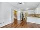 Kitchen with stainless steel appliances and hardwood floors leading to staircase at 1002 Saddle Hl, Marietta, GA 30068