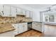 Bright kitchen featuring granite countertops, stainless steel appliances and a breakfast nook at 1002 Saddle Hl, Marietta, GA 30068