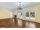 Living room with a fireplace, hardwood floors and french doors leading to back yard at 1002 Saddle Hl, Marietta, GA 30068