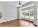 Sunroom filled with natural light and hardwood floors at 1002 Saddle Hl, Marietta, GA 30068