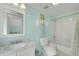 Bathroom featuring tile floors, a marble vanity, toilet, tub, and bright blue walls at 1356 Emory Ne Rd, Atlanta, GA 30306