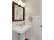 Bathroom featuring a pedestal vanity with an updated faucet and wainscoting at 1356 Emory Ne Rd, Atlanta, GA 30306