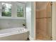 Bathroom with a jacuzzi tub and glass shower at 1356 Emory Ne Rd, Atlanta, GA 30306