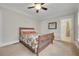 Bedroom features a bed, carpet, ensuite bathroom, and neutral color palette at 1356 Emory Ne Rd, Atlanta, GA 30306