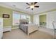 Bedroom features a bed, storage chest, large windows, closet and neutral color palette at 1356 Emory Ne Rd, Atlanta, GA 30306