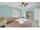 Bright bedroom features a ceiling fan, window and a colorful striped bed and rug at 1356 Emory Ne Rd, Atlanta, GA 30306