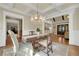 Bright dining room featuring coffered ceiling and natural light from many windows at 1356 Emory Ne Rd, Atlanta, GA 30306