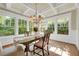 Bright dining room with coffered ceiling and natural light from large windows at 1356 Emory Ne Rd, Atlanta, GA 30306