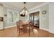Bright dining room with hardwood floors features windows and light fixture at 1356 Emory Ne Rd, Atlanta, GA 30306