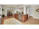 Spacious eat-in kitchen features a large island, stainless steel appliances, and hardwood floors at 1356 Emory Ne Rd, Atlanta, GA 30306