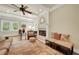 Bright living room featuring a fireplace, hardwood floors, and large windows at 1356 Emory Ne Rd, Atlanta, GA 30306