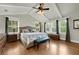 Spacious main bedroom with hardwood floors, ceiling fan, and abundant natural light at 1356 Emory Ne Rd, Atlanta, GA 30306