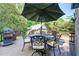 Deck with wrought iron table, umbrella, and a grill perfect for outdoor entertaining at 1356 Emory Ne Rd, Atlanta, GA 30306