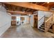 Unfinished basement with washer, dryer, and exposed ceiling beams at 2025 Oakley Se Trce, Smyrna, GA 30080