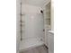 Bathroom features white subway tile shower and sleek vanity with shelves at 2025 Oakley Se Trce, Smyrna, GA 30080